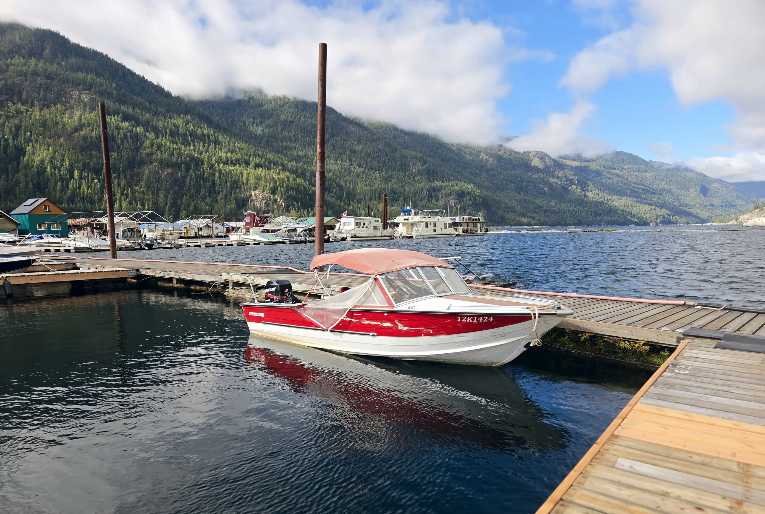 The Starcraft, a red and white rental boat, tied up at the Scotties Marina dock.
